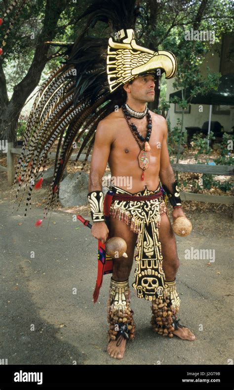 Man Wears An Ornate Golden Aztec Regalia Of Breechclout Apron Arm