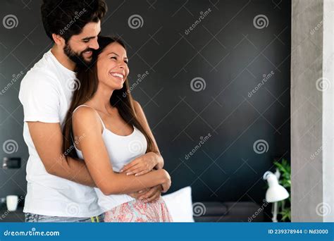 Beautiful Young Loving Couple Bonding To Each Other While Man Embracing