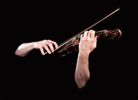 Premium Photo Hands Playing Wooden Violin