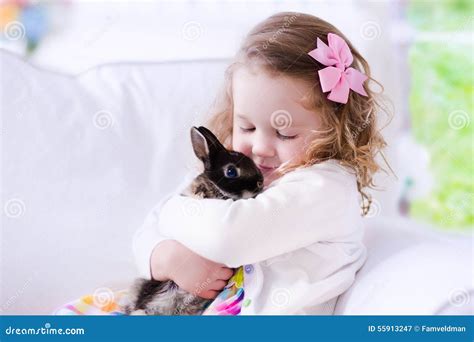 Little Girl Playing With A Real Pet Rabbit Stock Image Image Of Love