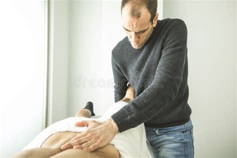 Physiotherapist Massaging A Young Man Back In A Clinic Concept Physiotherapy And Medicine Stock