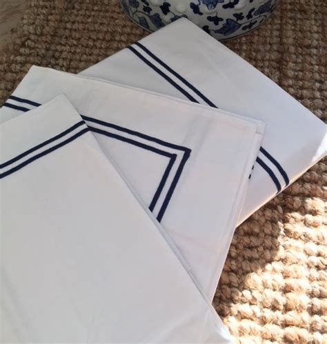 white sheets  navy blue trim