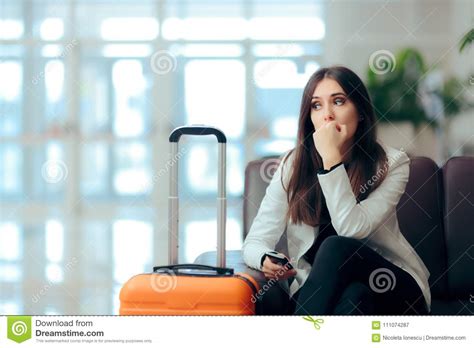 Sad Melancholic Woman With Suitcase In Airport Waiting Room Stock Image