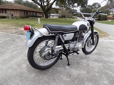 2 exhaust systems and mufflers, couple of headlight casings, 3 metal side covers, maybe for ca77. 1967 Honda 305 Scrambler Motorcycles for sale