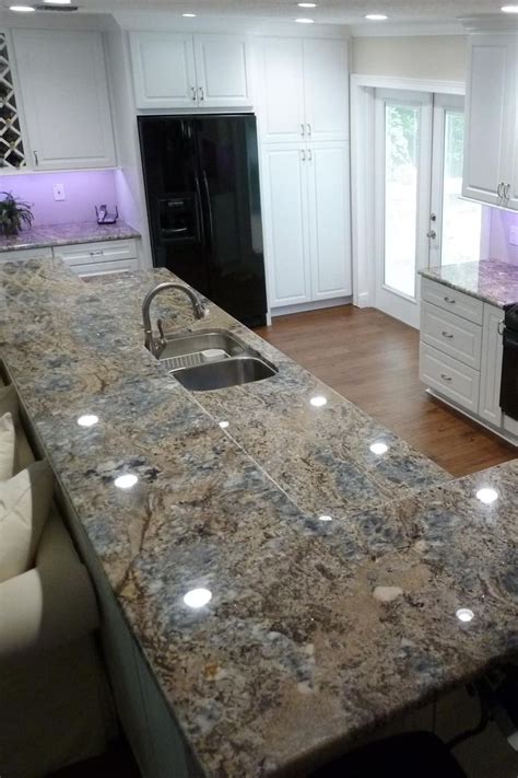 Blue Flower Granite Countertop White Cabinet Dark Hardwood Floor Subway