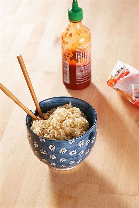 Hold the noodles in your mouth and slurp them in, but not like a little kid eating spaghetti. How To Use Chopsticks With Noodles - HOWOWOR
