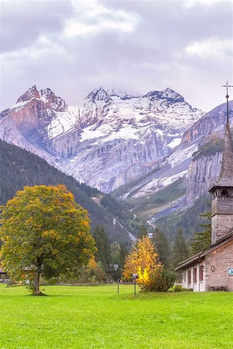 Church At Kandersteg Switzerland Backed By Mountains And Waterfalls