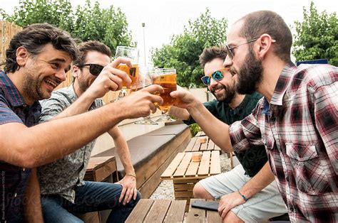 Friends Drinking Beer On A Bar By Stocksy Contributor Bisual Studio