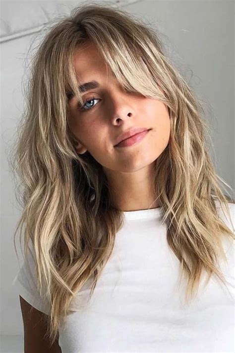 In this flirty flip choppy hairstyle, the long side bangs perfectly blends into layers. 35 Pretty Collarbone Length Haircuts