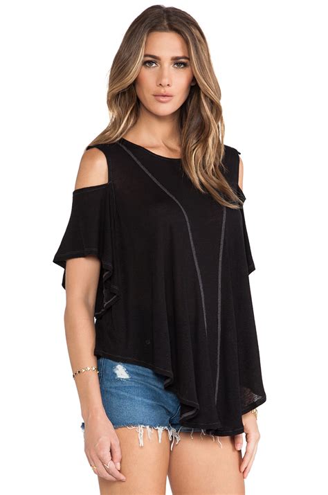 Then, theyll notice your shoulders, peeking through and making a statement. Free people Cold Shoulder Top in Black | Lyst