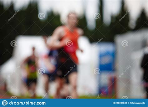 Sportsman Runs In A Running Competition Photograph In Blur Stock