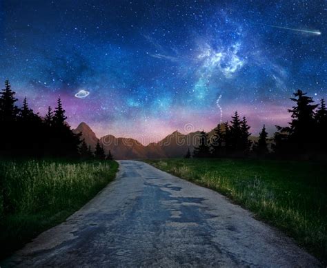 Old Dark Night Road Through Forest And Starry Sky With Galaxy And