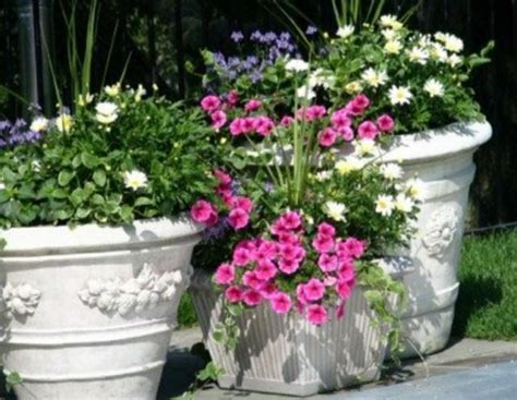 Looking for a good deal on outdoor planter? Three white beautiful garden planters.JPG