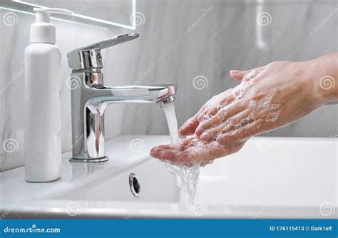 Young Woman Washing Cleansing Hands With Soap In Bathroom Close Up