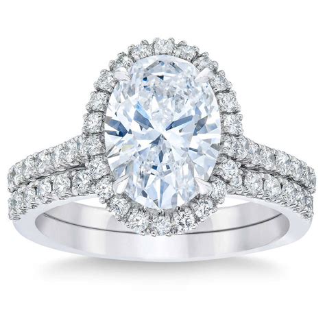 Shop halo rings in stylish cuts like princess and baguette at costco.com to find the perfect piece of jewelry at a great value today! 2.75ctw Oval Cut Diamond Halo Wedding Ring Set, Platinum | Costco UK