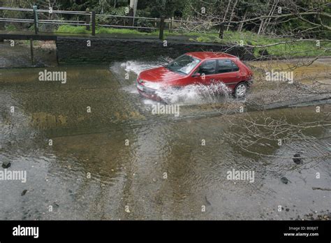 Car Driving Through Ford Stock Photo Alamy