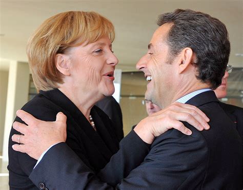 She is shown in uniform marching with a group of friends and an east german officer. Europe's Odd Couple: Sarkozy and Merkel - The New York Times