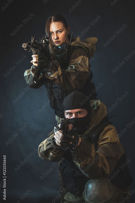 Man And Woman In The Images Of A Members Of The Special Forces Division