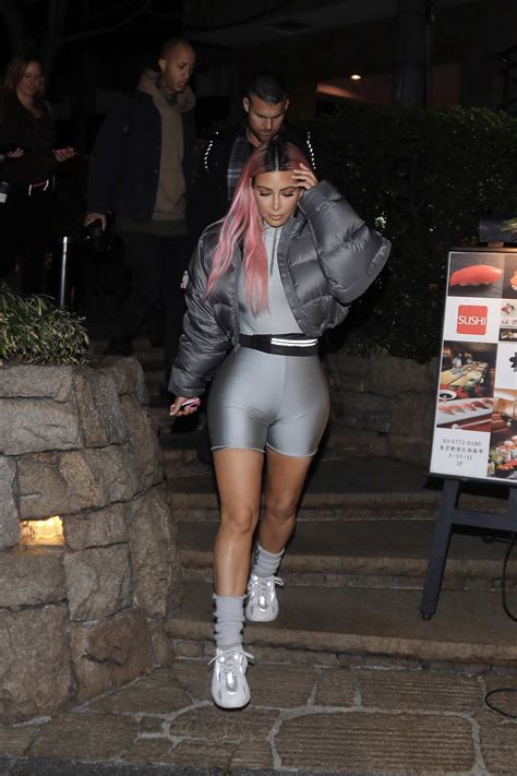 Kim Kardashian Wears Grey Biker Shorts With Matching Puffer Jacket While Out With Kourtney
