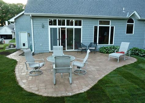 I need to build stairs from my house down to my patio as shown in the picture. Deck vs. Patio - Which is Right for Me? | Axel Landscape