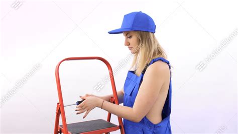 Naked Girl With Screwdriver In Blue Overalls Near Ladder At White Background Stock Video Footage