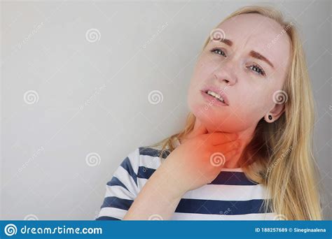 The Girl Touches The Upper Part Of The Neck Pain Is Visible On Her