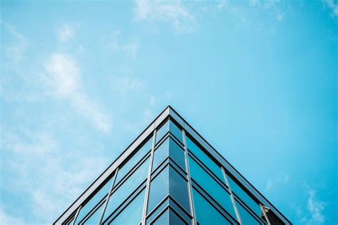 Business Skyscraper Office Building And Blue Sky Free Stock Photo
