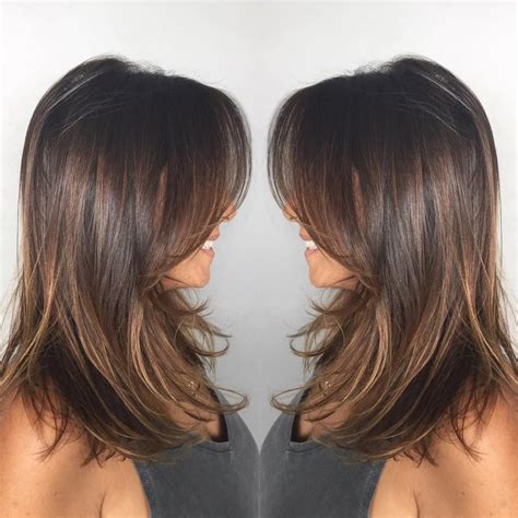 When styling medium length haircuts you should be paying particular attention to what you've been blessed with this style is all about the texture. Dark-Ash-Brown Mid-Length Hair with Wispy Layers | Haircuts for medium hair, Medium hair styles ...