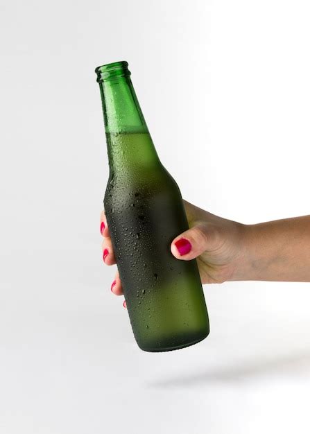 Free Photo Hand Holding Beer Bottle