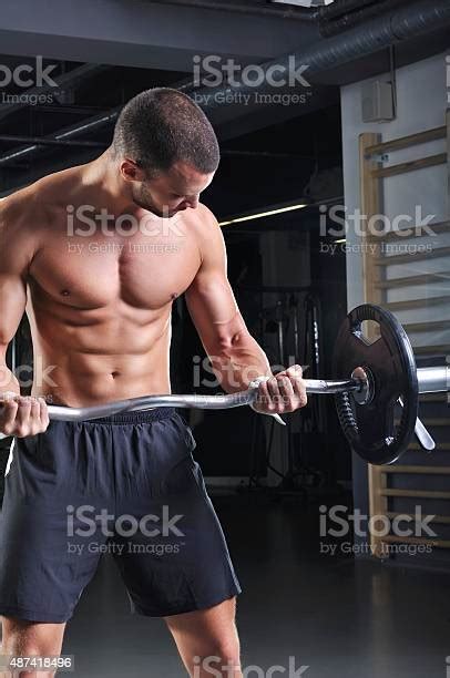 Handsome Muscular Male Model With Perfect Body Doing Biceps Exercise