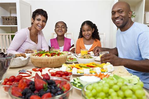 African American Parents Children Family Eating At Dining Table | Skin Care