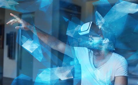 Young Man With Vr Glasses Playing Virtual Reality With Blue Glow Stock
