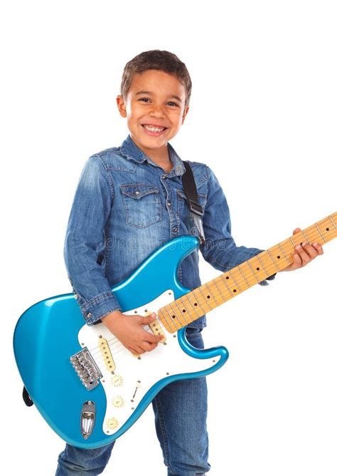 Niño Feliz Que Toca La Guitarra Azul Eléctrica Foto De Archivo Imagen