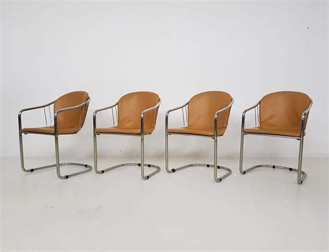 Shop online for chairs and benches in modern upholstery such as velvet, leather and rattan. Set of 4 Tubular chrome & cognac leather dining chairs by ...