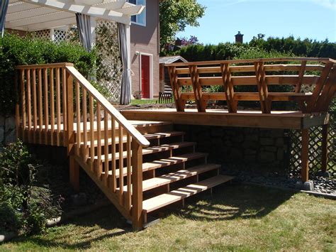 Cut stair treads so that they overlap the stringers by about 1 on both sides. Deck, Stairs and Bench - VictoriaRenovations.ca