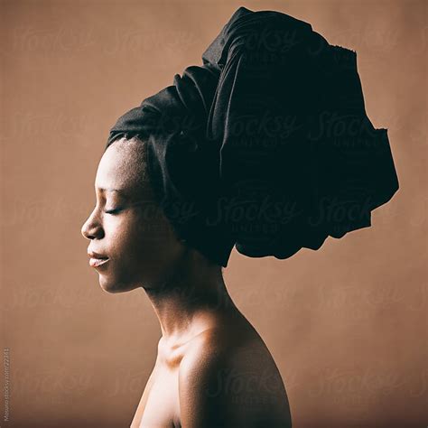 Black Woman With The Black Turban On Her Head By Mosuno Beauty Portrait Stocksy United