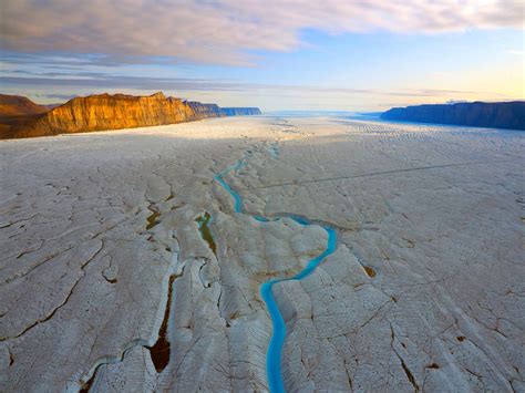 Thick Sea Ice Warms Greenland Fjords