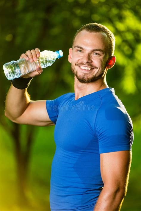 Athletic Mature Man Drinking Water From A Bottle Stock Photo Image Of