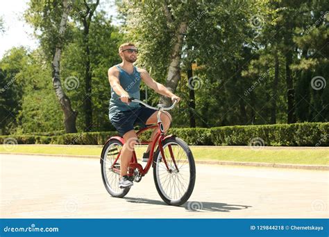 Attractive Man Riding Bike Outdoors Stock Photo Image Of Person