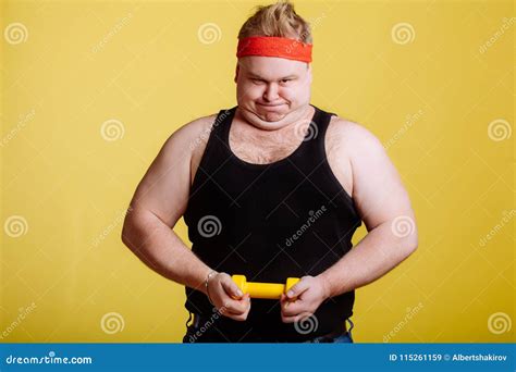 Fat Man Try To Lift Small Yellow Dambbell Stock Image Image Of Look