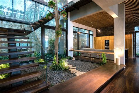 The Interior Of A Modern House With Wood And Glass