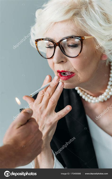 Senior Lady Smoking Cigarette — Free Stock Photo © Allaserebrina 170490886