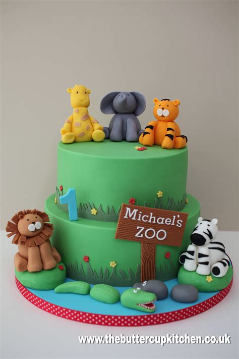 A Zoo Themed Cake For A One Year Olds Birthday With All His