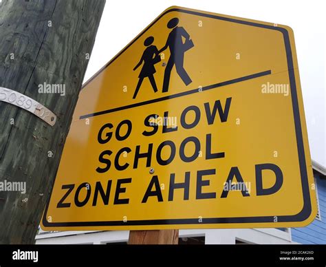Go Slow School Zone Ahead Road Sign Stock Photo Alamy