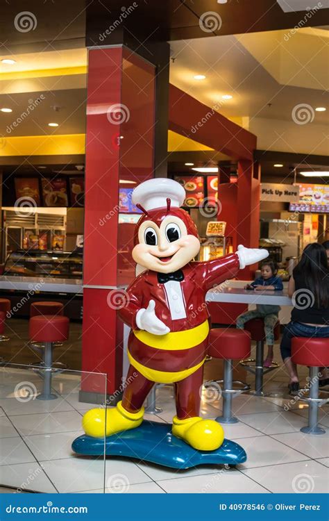 Jollibee Mascot And A Sumo Wrestler Mascot Invite Customers To Dine