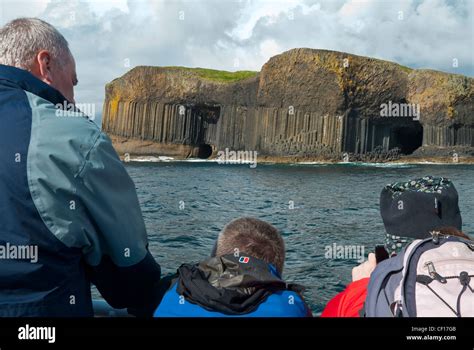 Fingals Cave And Mackinnons Cave On The Isle Of Staffa With Tourists