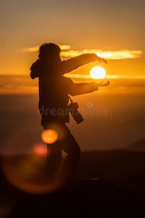 Girl Catching The Sun At Sunset With The Golden Sky Selective Focus