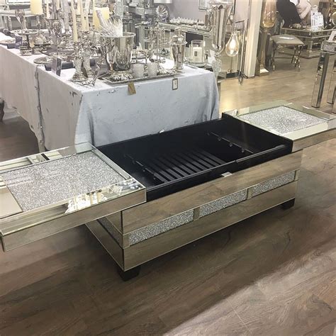The new classy mirrored glass coffee table is inlaid with diamond crushed glass crystals that give a sparkling look. Diamond Glitz Mirrored Crystal Coffee Table Wine Storage ...