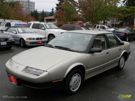 We analyze millions of used cars daily. 1995 Gold Metallic Saturn S Series SL1 Sedan #57873792 Photo #7 | GTCarLot.com - Car Color Galleries