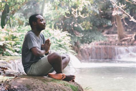 African Man Meditate Spiritual Peaceful Praying And Wishing In Green
